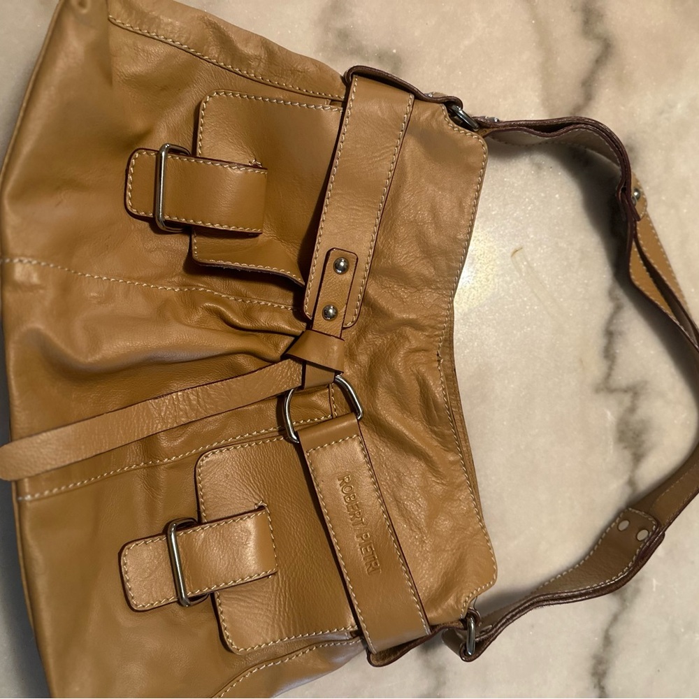 Leather Tan Shoulder Bag with Slouchy Design and Decorative Buckles